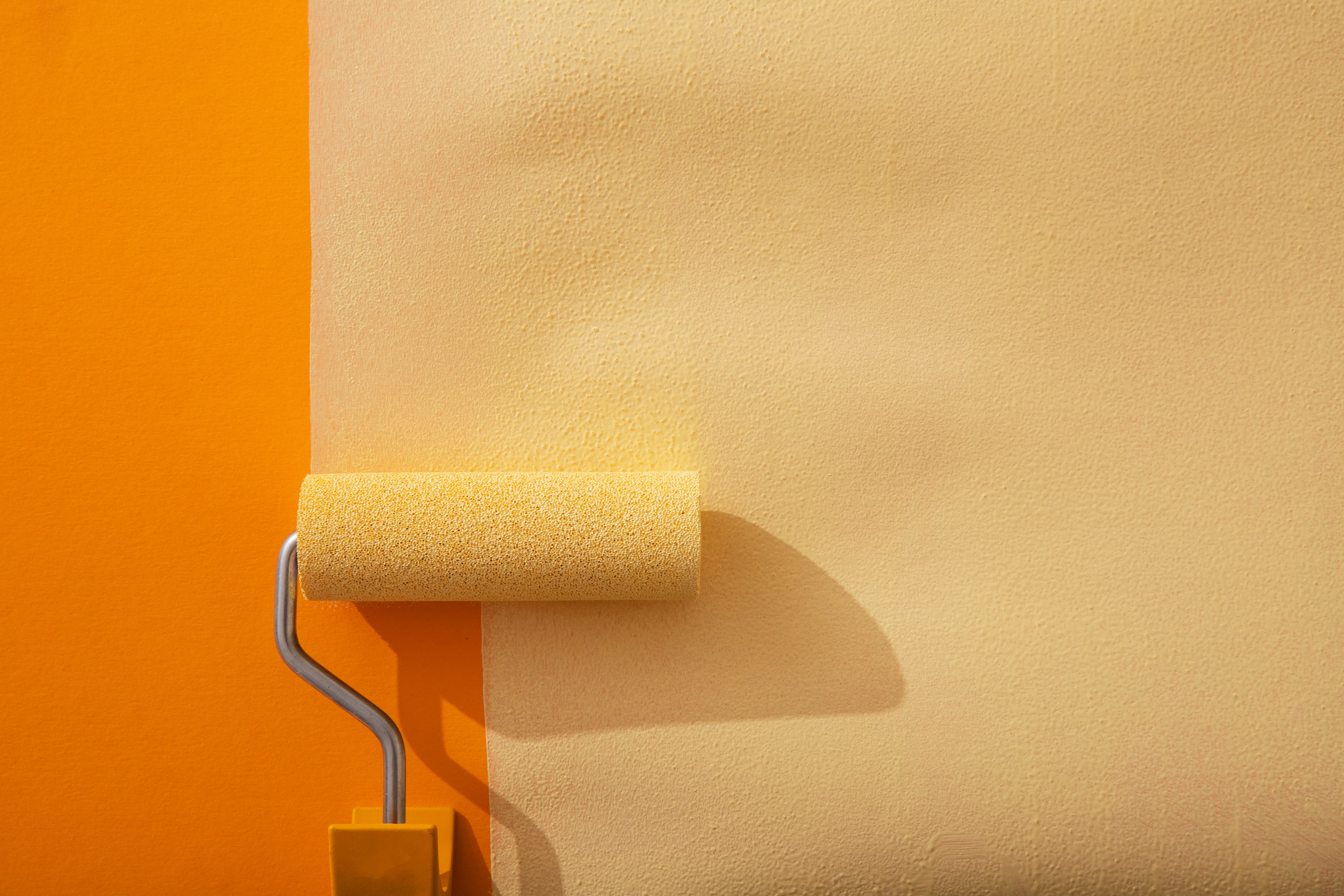 a paint roller on a wall